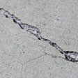sinking outdoor concrete in need of mudjacking in Quincy