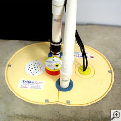 A sump pump system installed along a basement floor in Quincy.