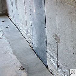 an ugly basement weeping tile drainage system that's clogged and not working in Keokuk.