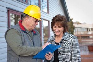 Illinois, Iowa, and Missouri Basement Remodeling Contractors at work at design table