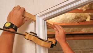 Installing trim and finishing touches to a remodeled basement in Mount Sterling, IL, IA, and MO