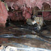 Fiberglass insulation dripping off some heating ducts in a wet crawl space in La Harpe.