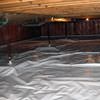 A sealed crawl space with support posts showing in Fort Madison.