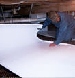 Palmyra insulation being installed in a crawl space.