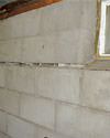 Severely buckling foundation walls in a home in West Point in need of repairs.