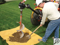 Auguring a hole in the earth for a foundation repair in Kahoka