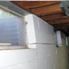 A foundation showing severe inward buckling along the windows in a Mason City home.