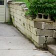 a collapsing retaining wall in Mount Sterling