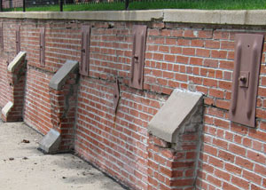 Rusted wall plate anchors in a retaining wall repair in La Harpe.