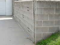 A retaining wall separating from the adjoining walls in Bellflower
