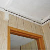 The ceiling and wall separating as the wall sinks with the slab floor in a Colchester home