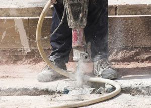 Jackhammering a slab floor in a Mount Sterling home.