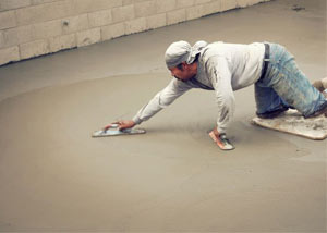 smoothing out the grout in a slab releveling project in Palmyra
