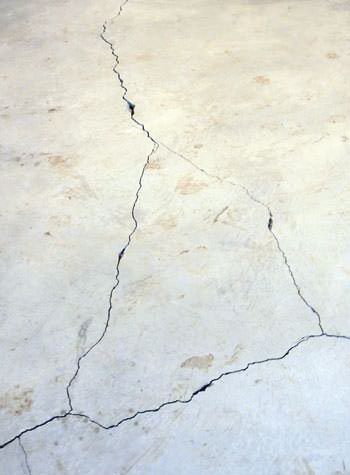 severely cracked, heaving slab floors in a home in Liberty