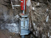 Foundation repair contractors lifting a structure in Macomb.