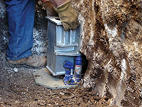 Securing a foundation footing bracket for a foundation repair system in Canton.