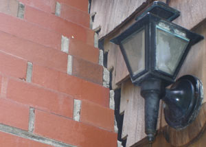 A tilting chimney in Memphis showing serious foundation damage.