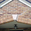 Major tuckpointing on a home archway over a door, with tuckpointing several inches wide that has failed on a Quincy home