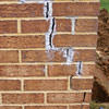 Tuckpointing that cracked due to foundation settlement of a Macomb home