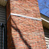 A tilting chimney on a Mendon home with a leaning, tilting chimney that was temporarily repaired.
