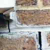 Failed crack repair showing old tuckpointing that cracked on a Kirksville home.
