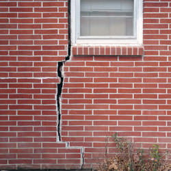 A foundation with a large crack that's wider at the top than on the bottom in Edina