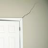 A long drywall crack beginning at the corner of a doorway in a Donnellson home.