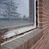 A gap in a window along the outer wall due to foundation settlement of a Hamilton home.