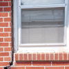 A gap in a window along the outer wall due to foundation settlement of a Hamilton home.