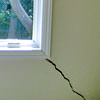 A long, diagonal crack that begins at a window corner of a West Point home
