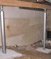 A system of crawl space support posts adding structural support to a crawl space in Astoria