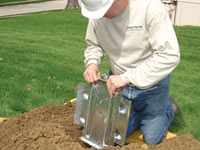 Fastening an earth anchor for a severely bowing wall in Mount Sterling.