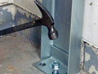 Mounting a foundation channel anchor installation to the floor in Palmyra.