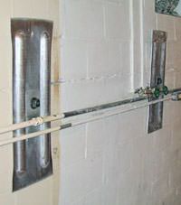 A foundation wall anchor system used to repair a basement wall in Warsaw