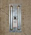 A fully exposed wall anchor plate installed along a Bellflower foundation wall