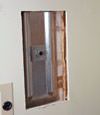 Wall anchor plates installed during a foundation repair in Macomb in a finished basement