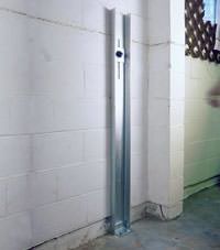 A failing foundation wall repaired with a foundation wall channel anchor system in a Peoria home.