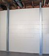 A steel i-beam system installed on a Bellflower foundation wall