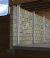 I-beam foundation wall supports installed in a Mendon basement.