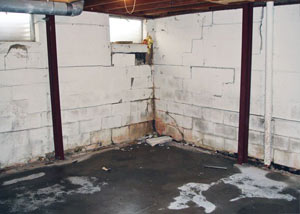 A failed, rusty i-beam foundation wall system installed in Edina.
