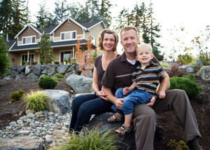 A happy family outside a home with a repaired foundation in Liberty
