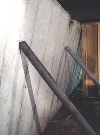 A foundation wall leaning in at the top in Mendon