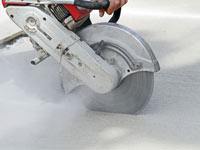 Cutting the driveway for expansion joints during street creep repair in Memphis