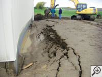 A foundation wall showing severe damage from bowing and buckling in Memphis