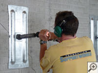 Mounting the steel wall plate for foundation wall repair and straightening in Montrose.