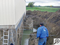 Drilling the hole in the foundation wall for street creep repairs in Camp Point