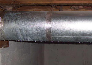 condensation collecting on an HVAC vent in a humid Kahoka basement