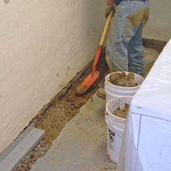 Digging a trench for a French Drain system in Quincy