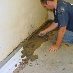 Testing a French drain system in a Carthage home.