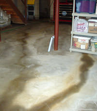 Flooding entering a basement through a floor crack in Donnellson
